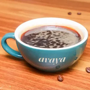 Hot and iced Caffe Americano in a glass cup, rich and aromatic, served at Avaya Café