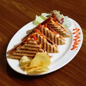Lal Pahadi spicy chicken sandwich with juicy grilled chicken, fiery spices, fresh vegetables and toasted bread served hot