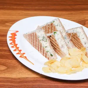 Egg Chicken and Cheese Sandwich with fluffy eggs, juicy chicken and melted cheese, freshly grilled and served hot at Avaya Café
