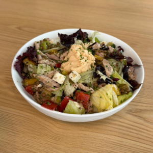 Protein bomb salad with lettuce grilled chicken paneer vegetables hummus and dressing served fresh at Avayacafe