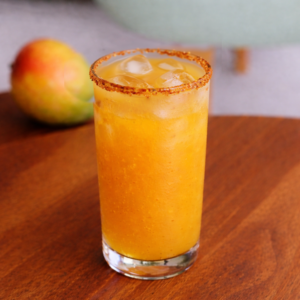 Glass of Alphonso Twist mango drink with mint and mango cubes at Avayacafe.