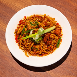Noodles in chili oil with garlic soy sauce and spring onions served fresh at Avayacafe