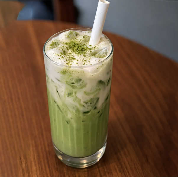 Layered Coconut Matcha Cloud drink with matcha cream and coconut chips served at Avayacafe.